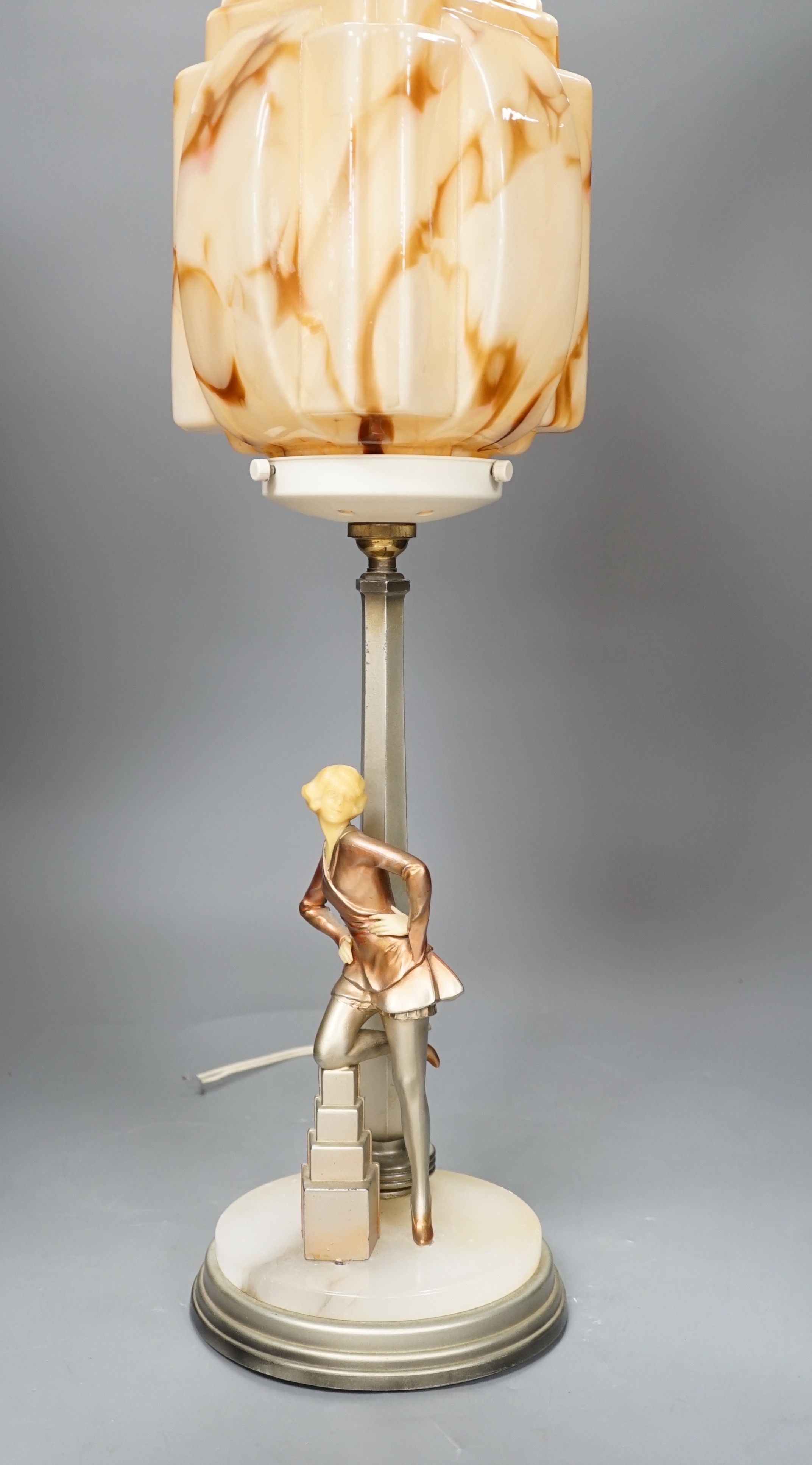 An Art Deco Cold painted spelter and composition figural table lamp and glass shade, 67cm high